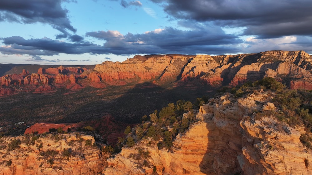 a view of a mountain range with clouds in the sky