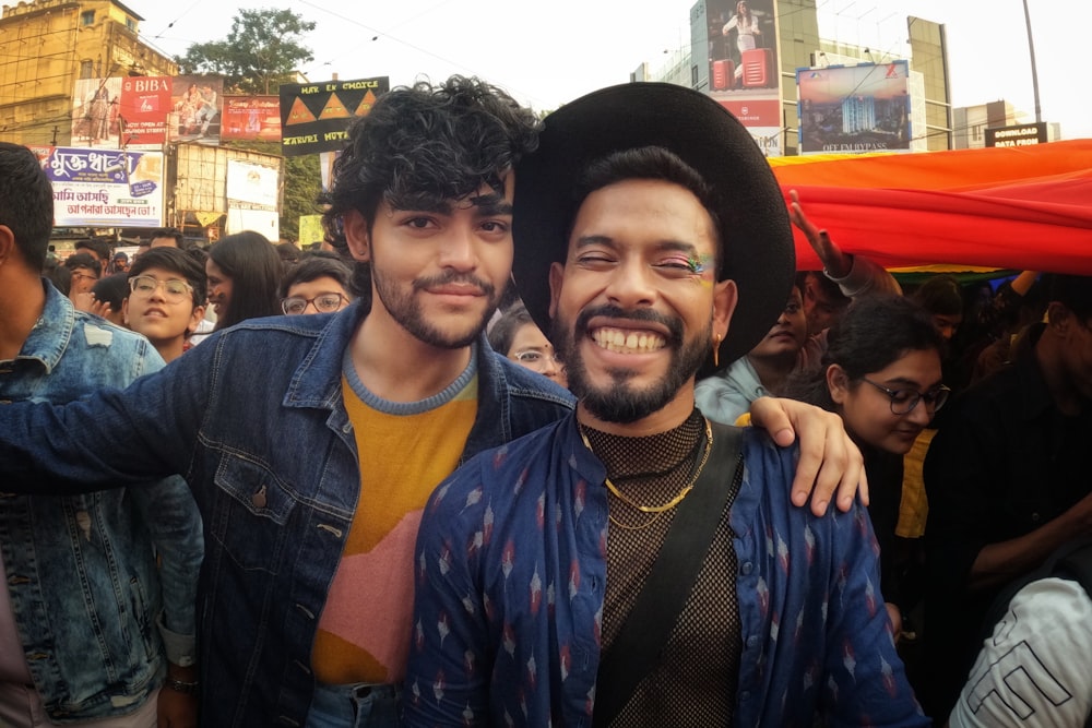 a couple of men standing next to each other