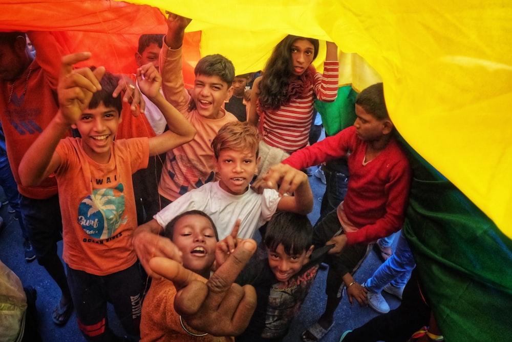 a group of young children standing next to each other