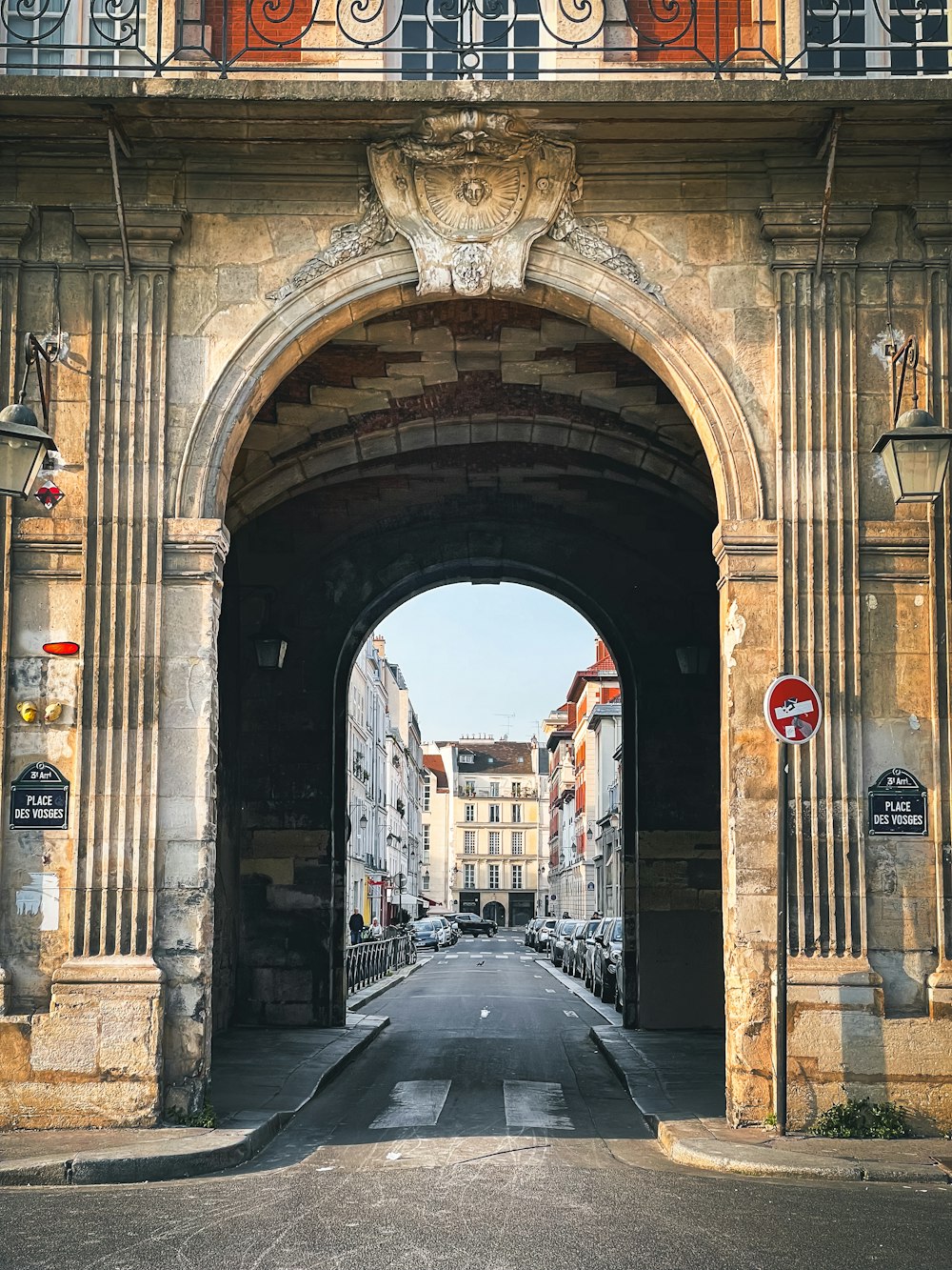 a large arch with a clock on the side of it