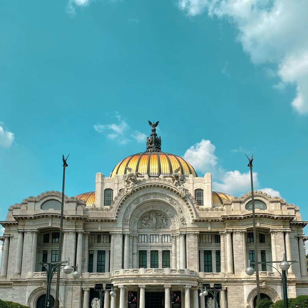 a large building with a yellow dome on top