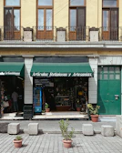 Brightly lit display of colorful Christian-themed accessories in the Luzvaría store.