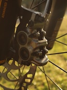 A close-up of brake pads and rotors on a workbench.