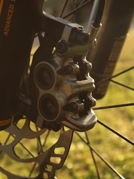 A close-up of brake pads and rotors on a workbench.