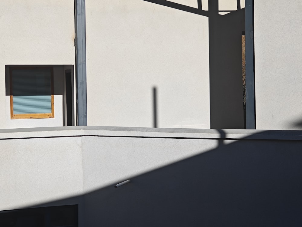 a building with a window and a small window on the side of it