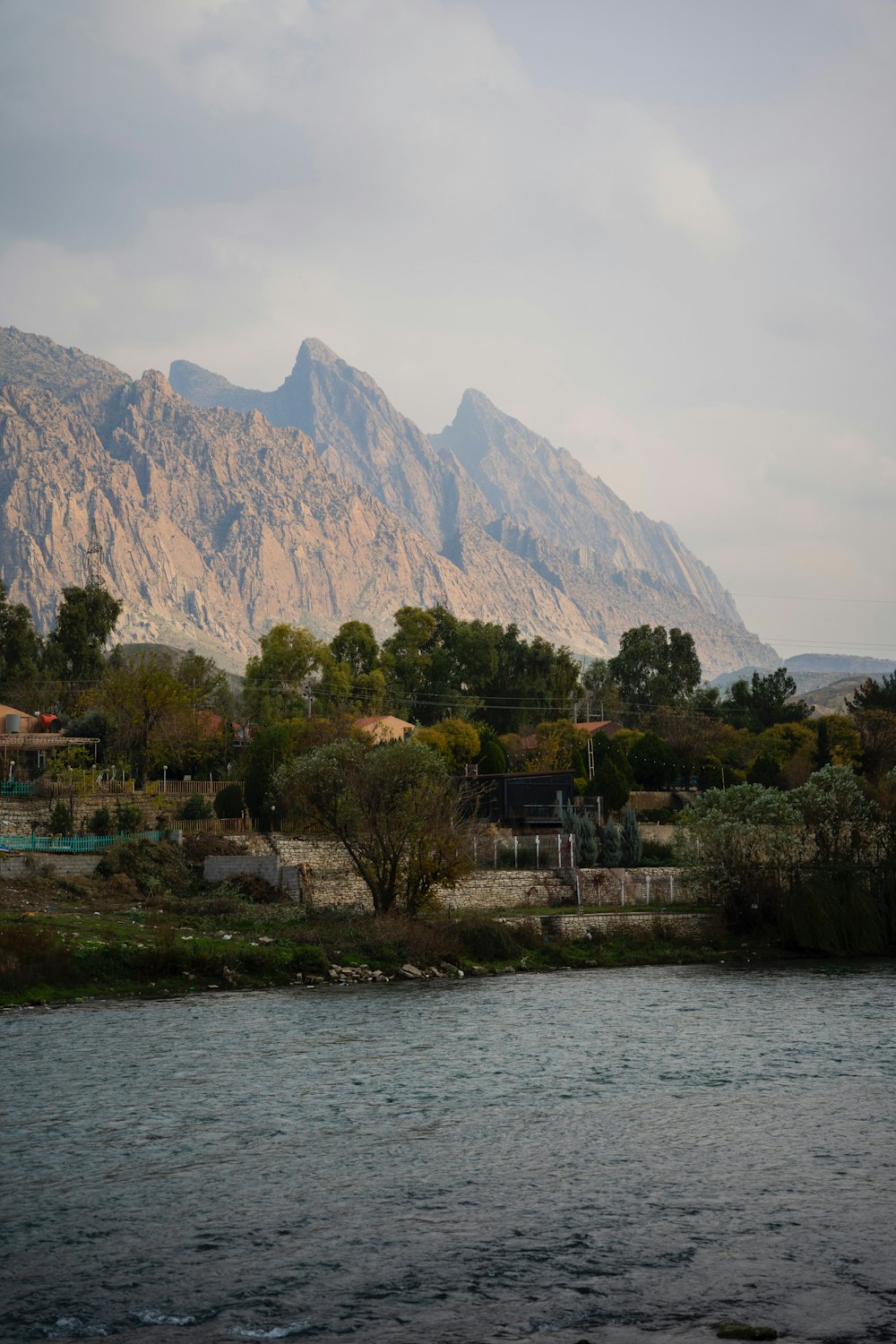 a body of water with a mountain in the background