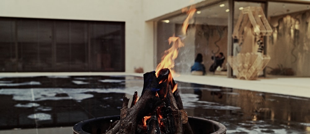 a fire pit with a fire burning inside of it