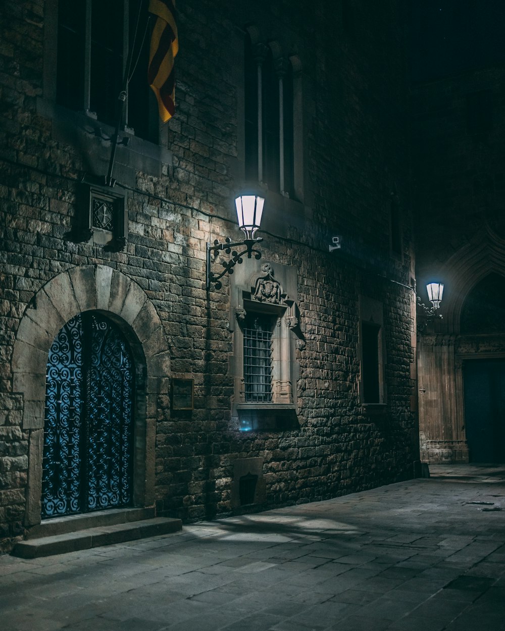 a stone building with a blue door and window