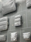 Various disposable bags and cleaning supplies displayed in a neat grid.