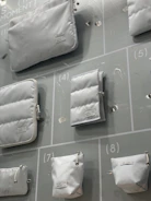 Various disposable bags and cleaning supplies displayed in a neat grid.