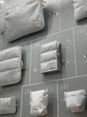 Clear plastic bags filled with various items, displayed on a clean white background.