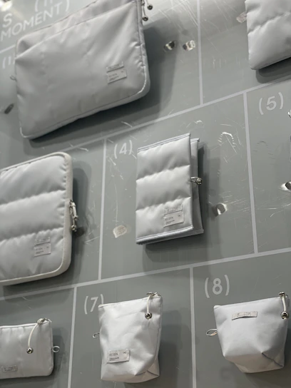 A vibrant assortment of storage bags in various sizes neatly arranged on shelves.