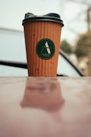 A colorful travel cup with a secure lid, perfect for on-the-go