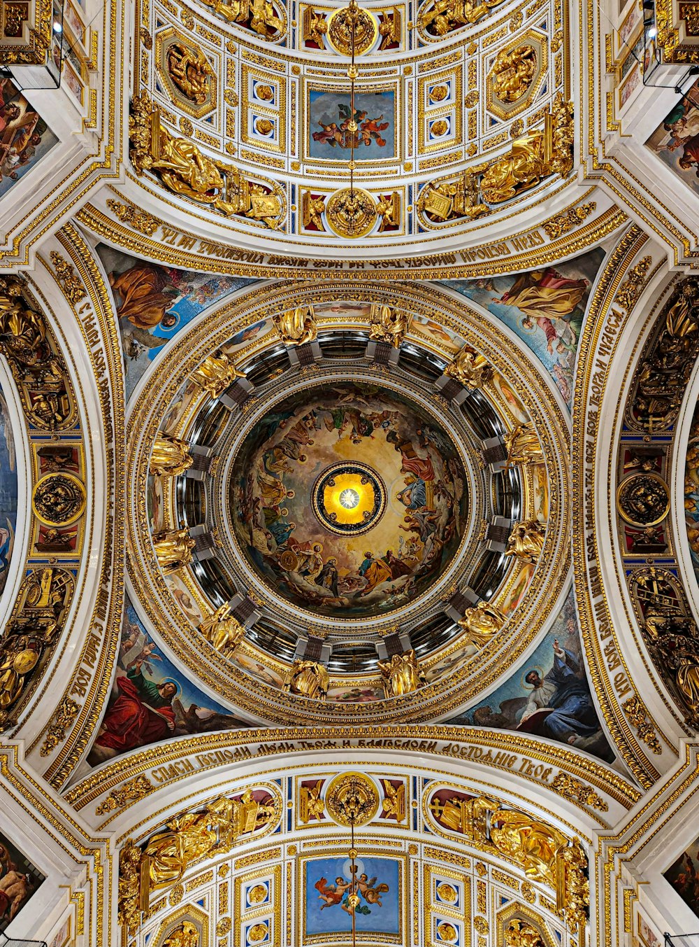 the ceiling of a church with paintings on it