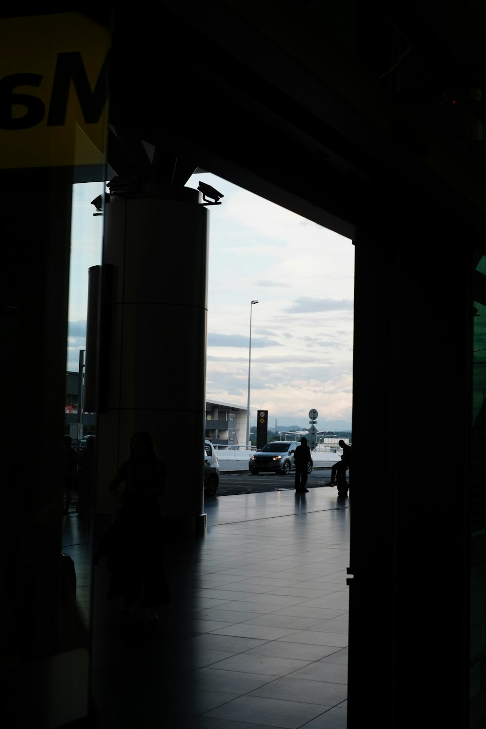 a person sitting on a bench in a building