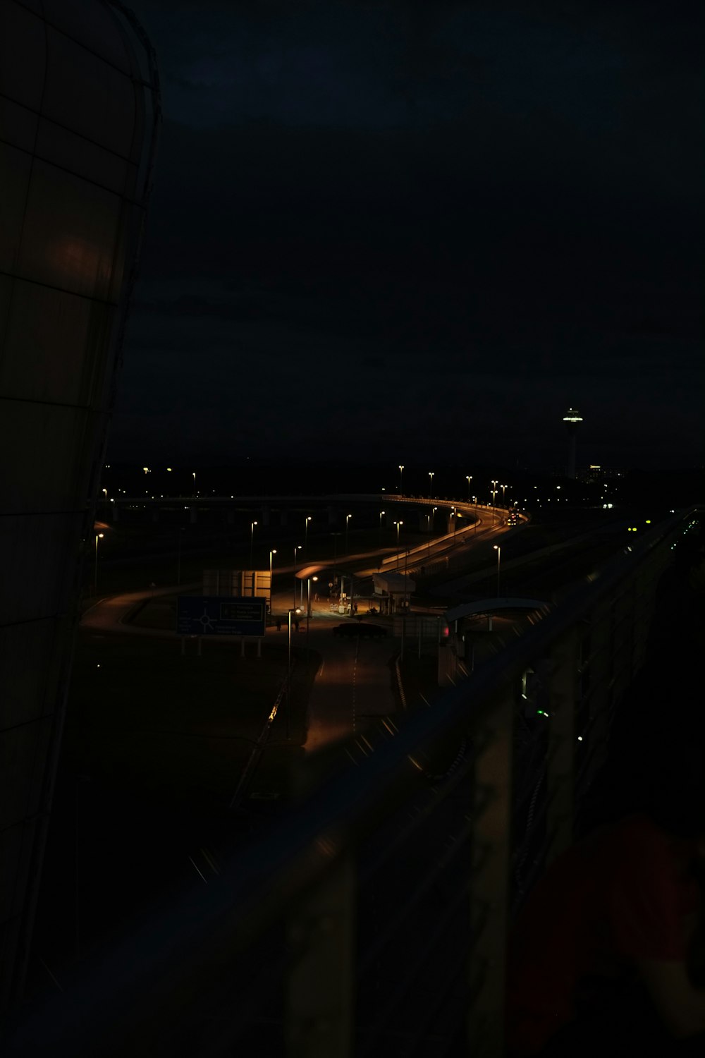 a view of a city at night from a balcony