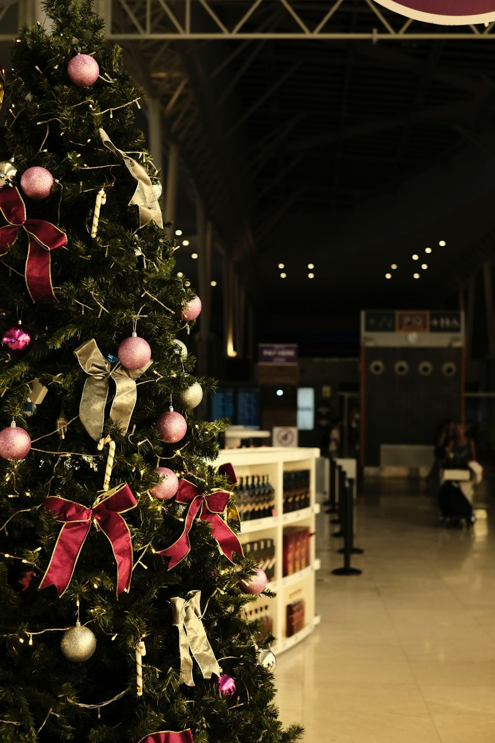 a decorated christmas tree in a large building