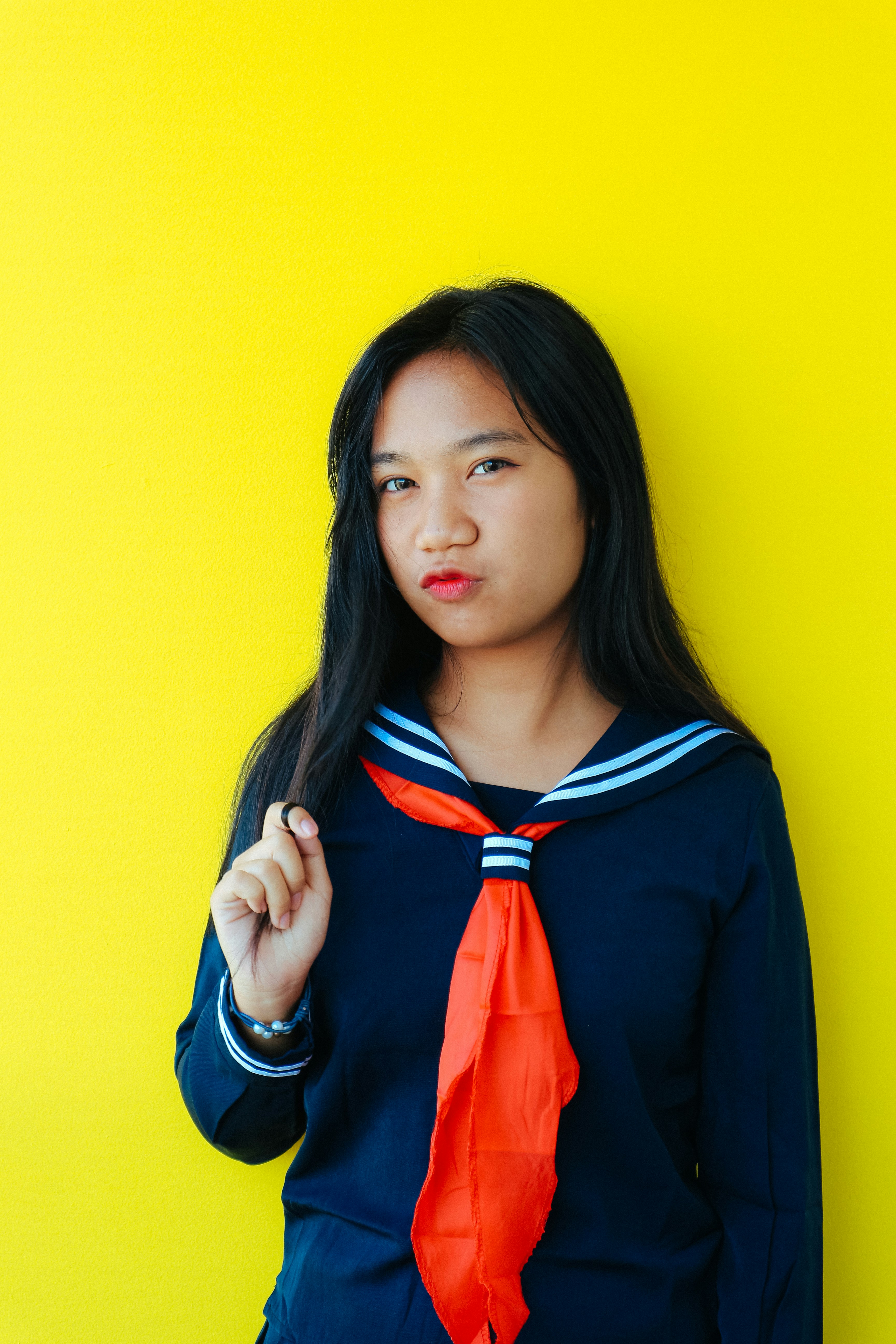 a woman in a sailor outfit poses for a picture