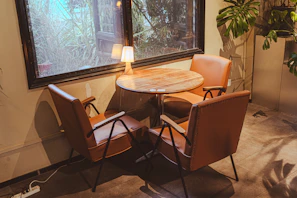 Comfortable seating area in the self-contained room with a small dining table.