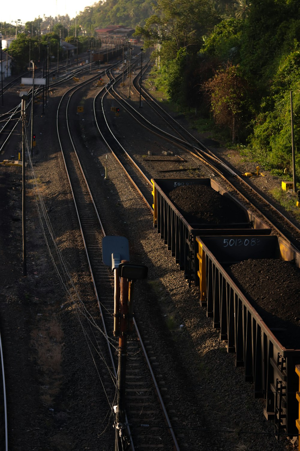 a train yard with a train on the tracks