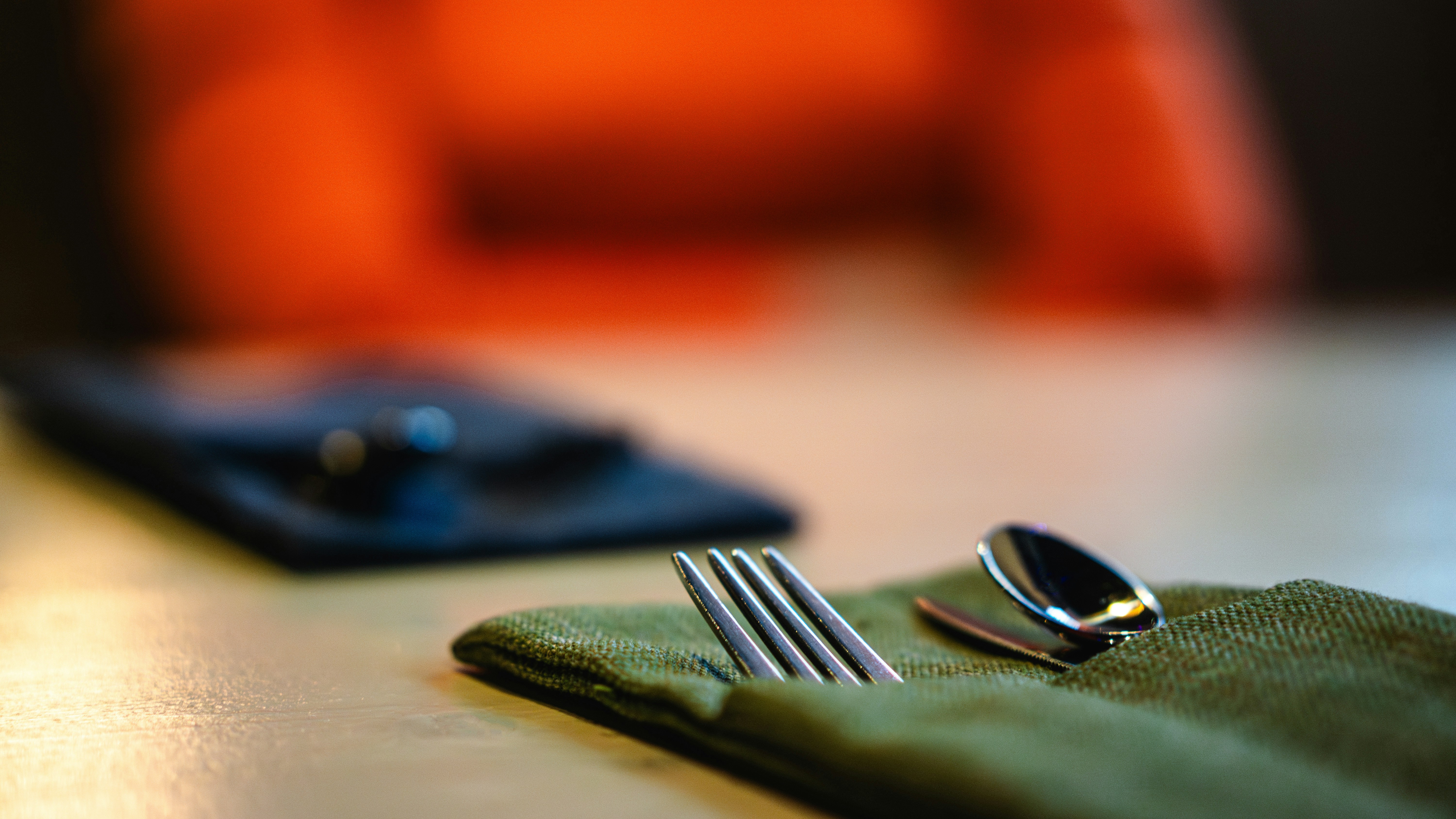 a fork, knife and napkin on a table