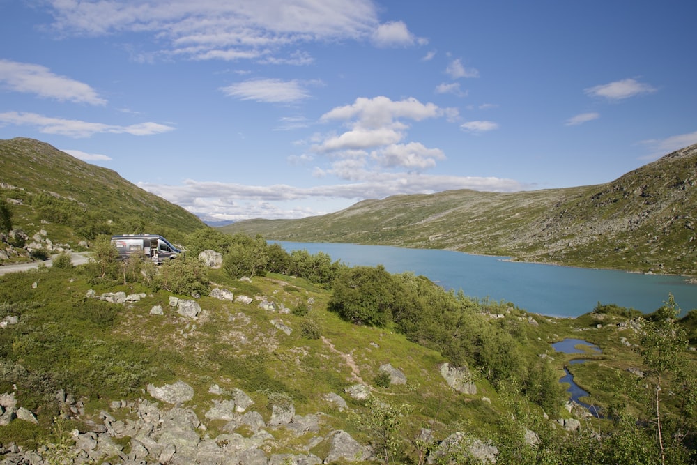 a van is parked on the side of a mountain