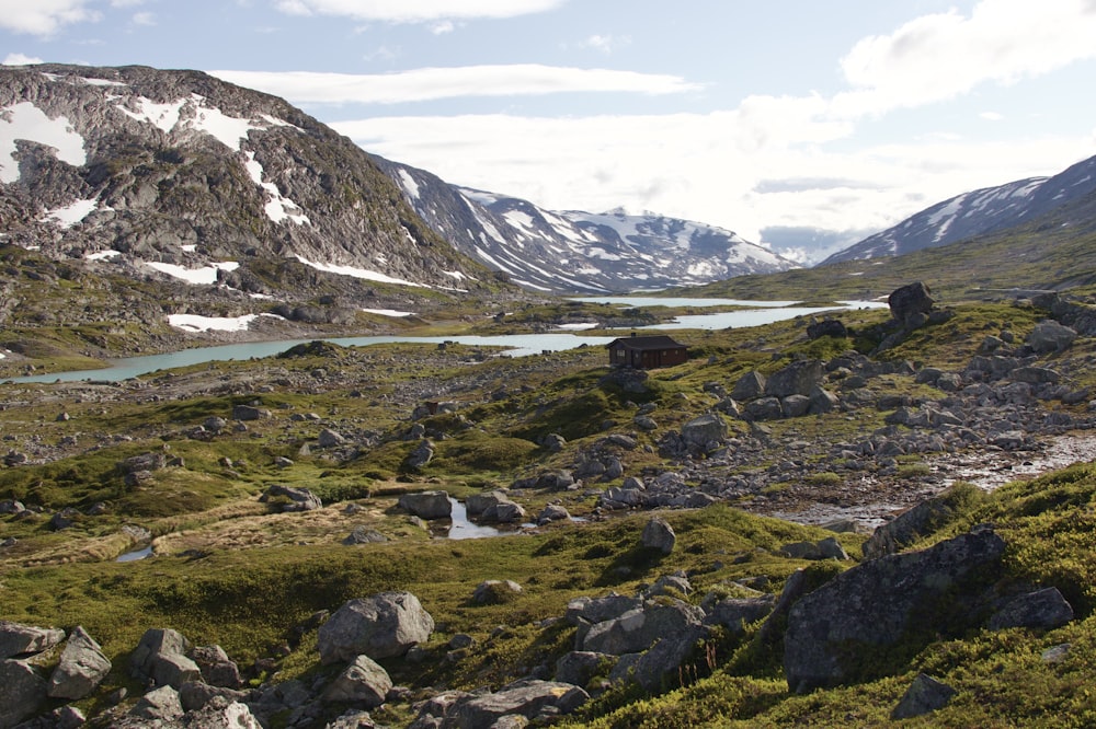 a view of a mountain with a lake in the middle of it