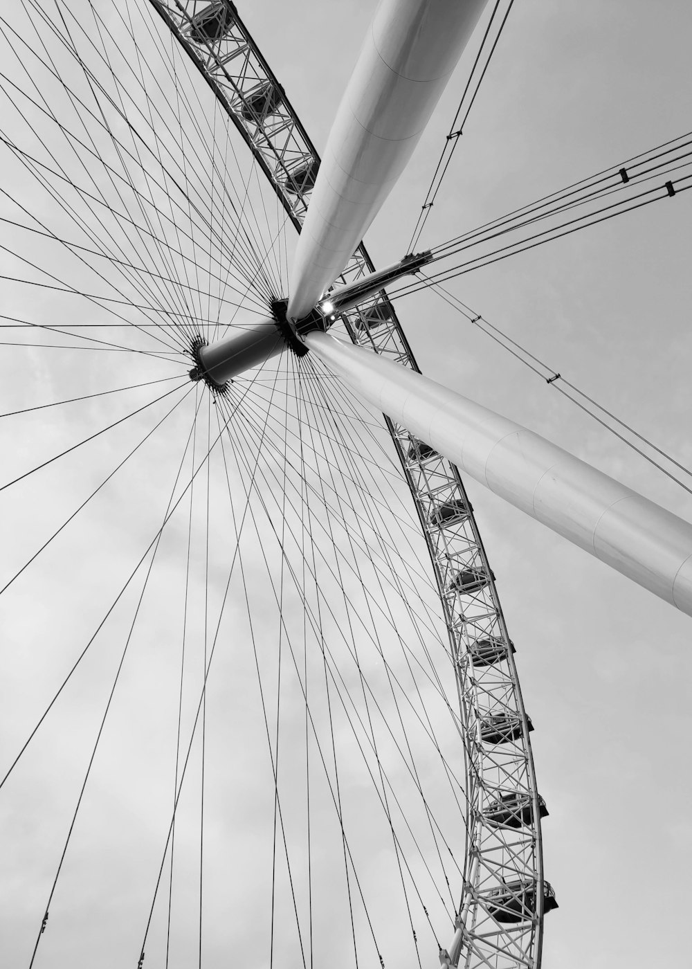 a black and white photo of a ferris wheel