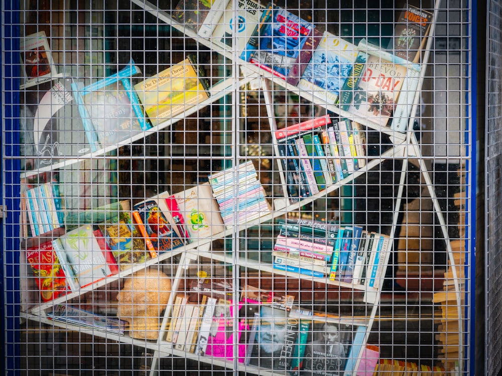 a bunch of books that are in a cage