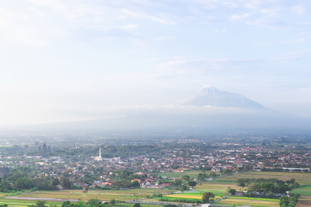 a view of a city with a mountain in the background