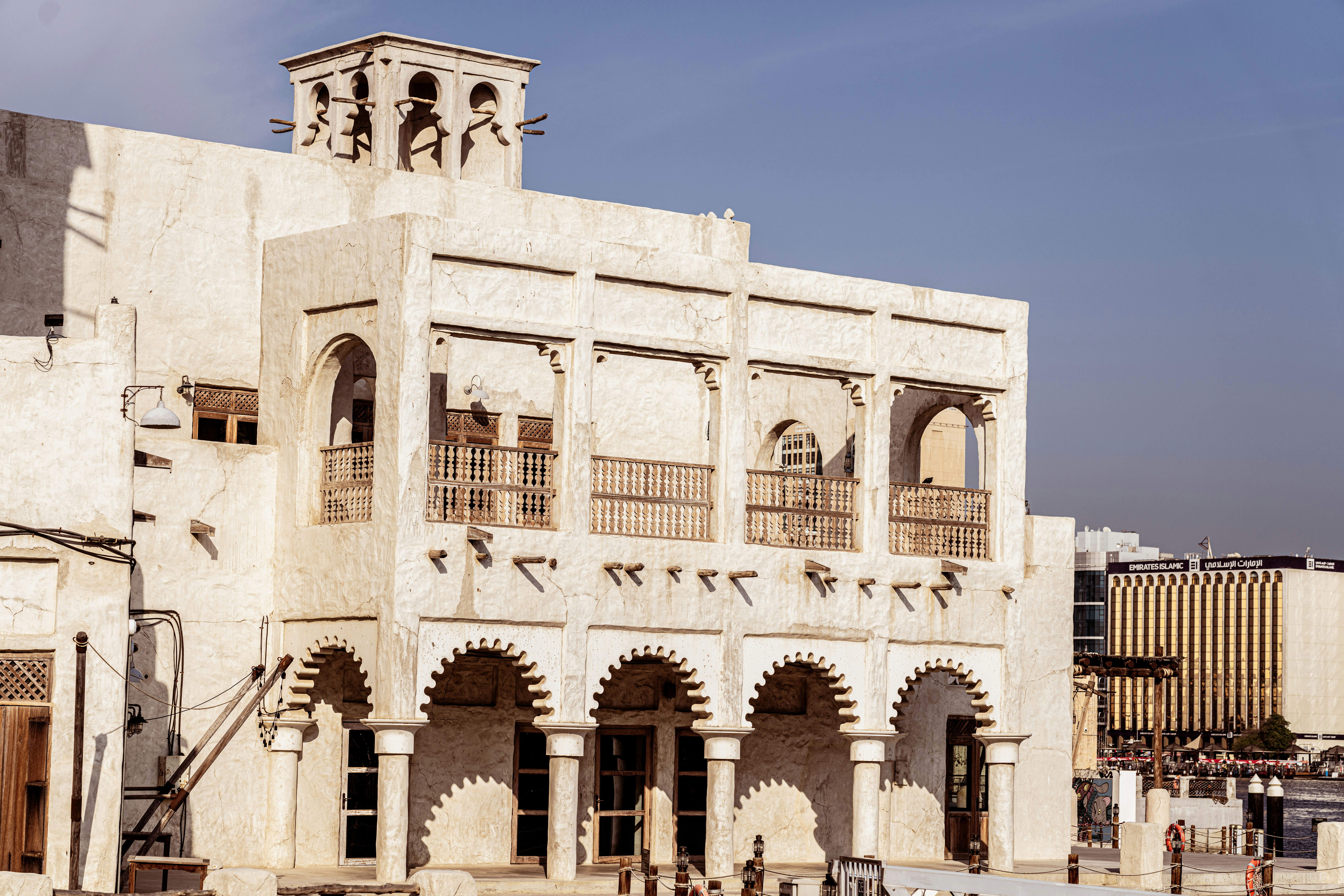 a large white building with a clock tower on top of it