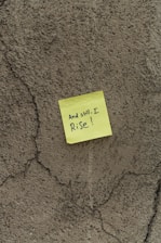 a piece of yellow paper with writing on it