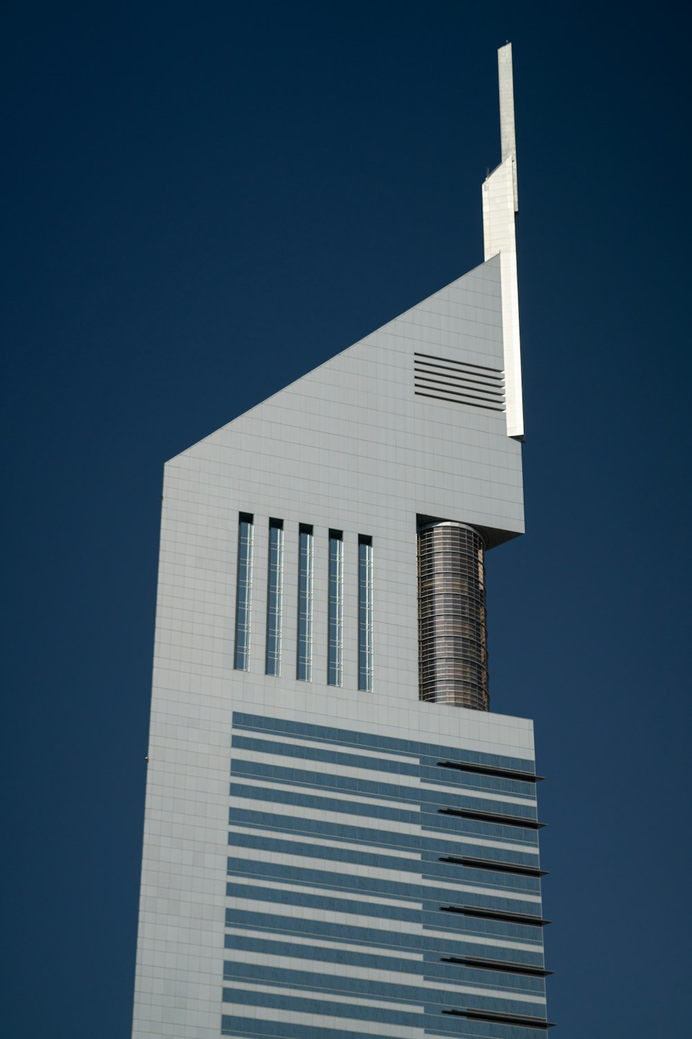 a tall building with a cross on the top of it