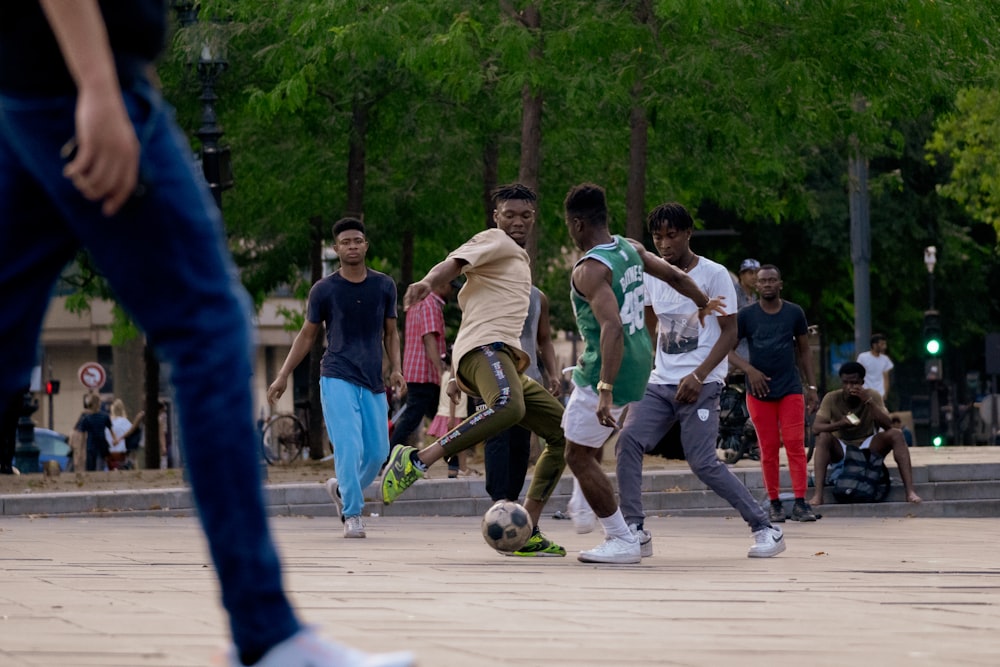 a group of young men playing a game of soccer