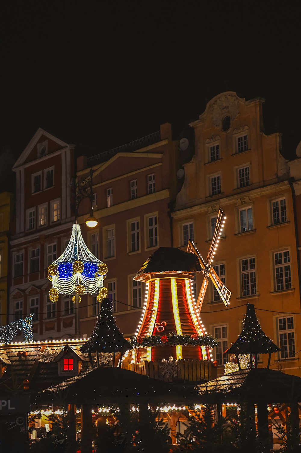 a merry go round in a city at night