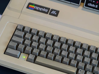 A classic 90s computer keyboard with yellowed keys, symbolizing early digital nostalgia.