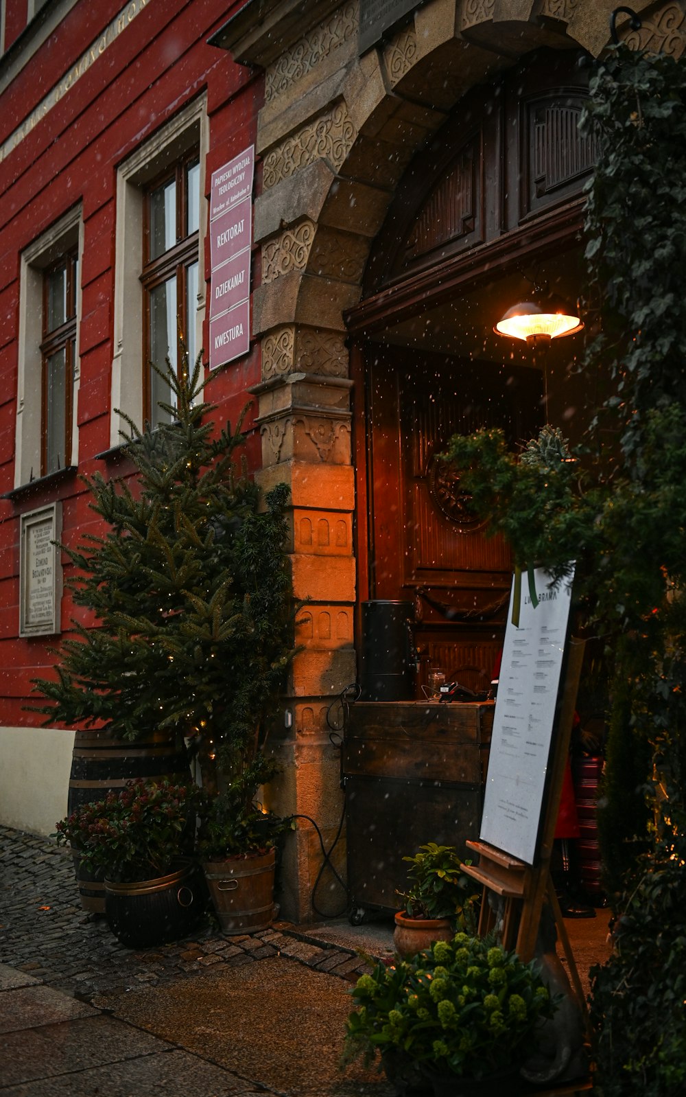 a red building with a sign in front of it