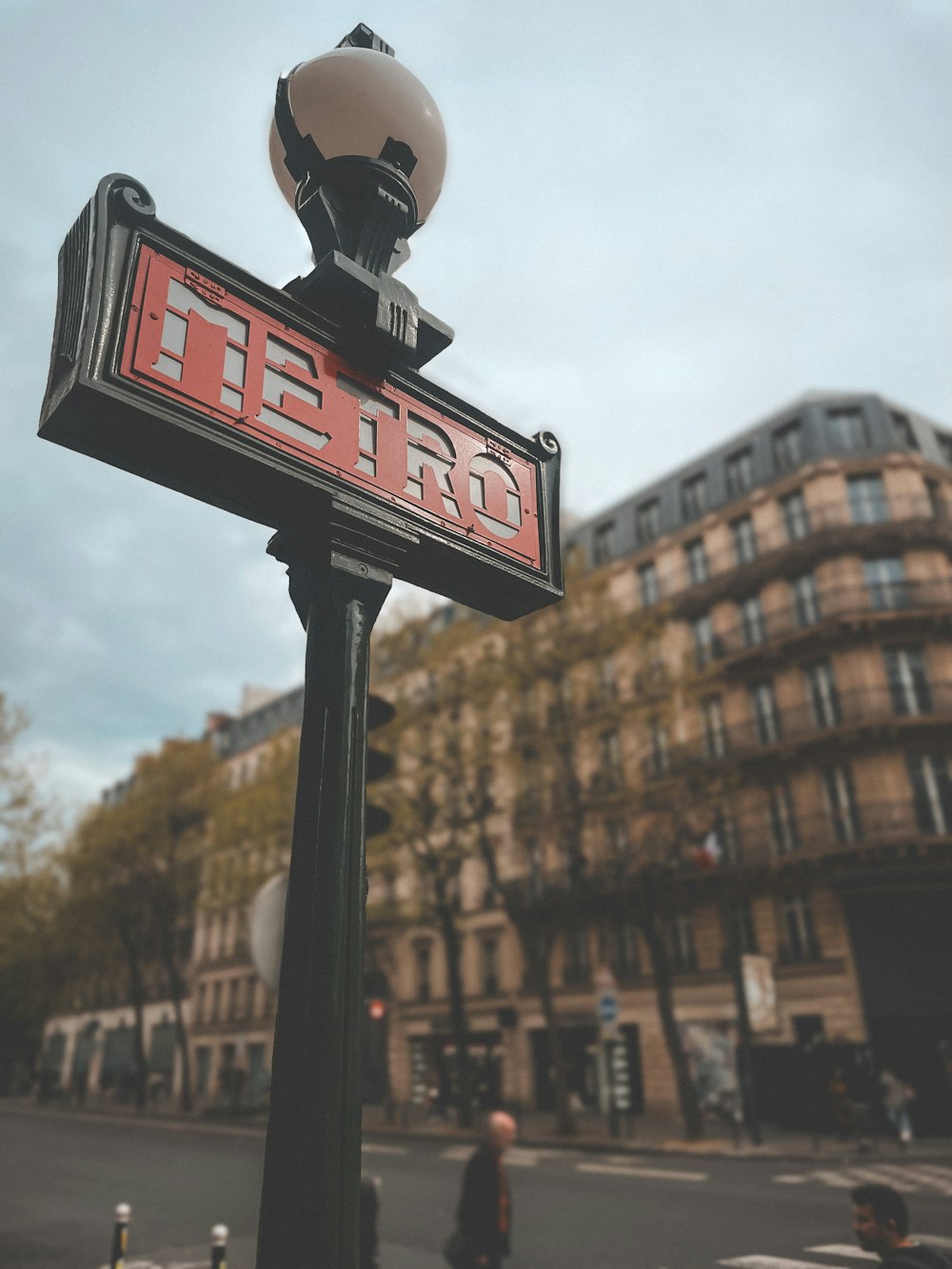 a street sign with a building in the background