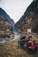 a motorcycle parked on the side of a mountain