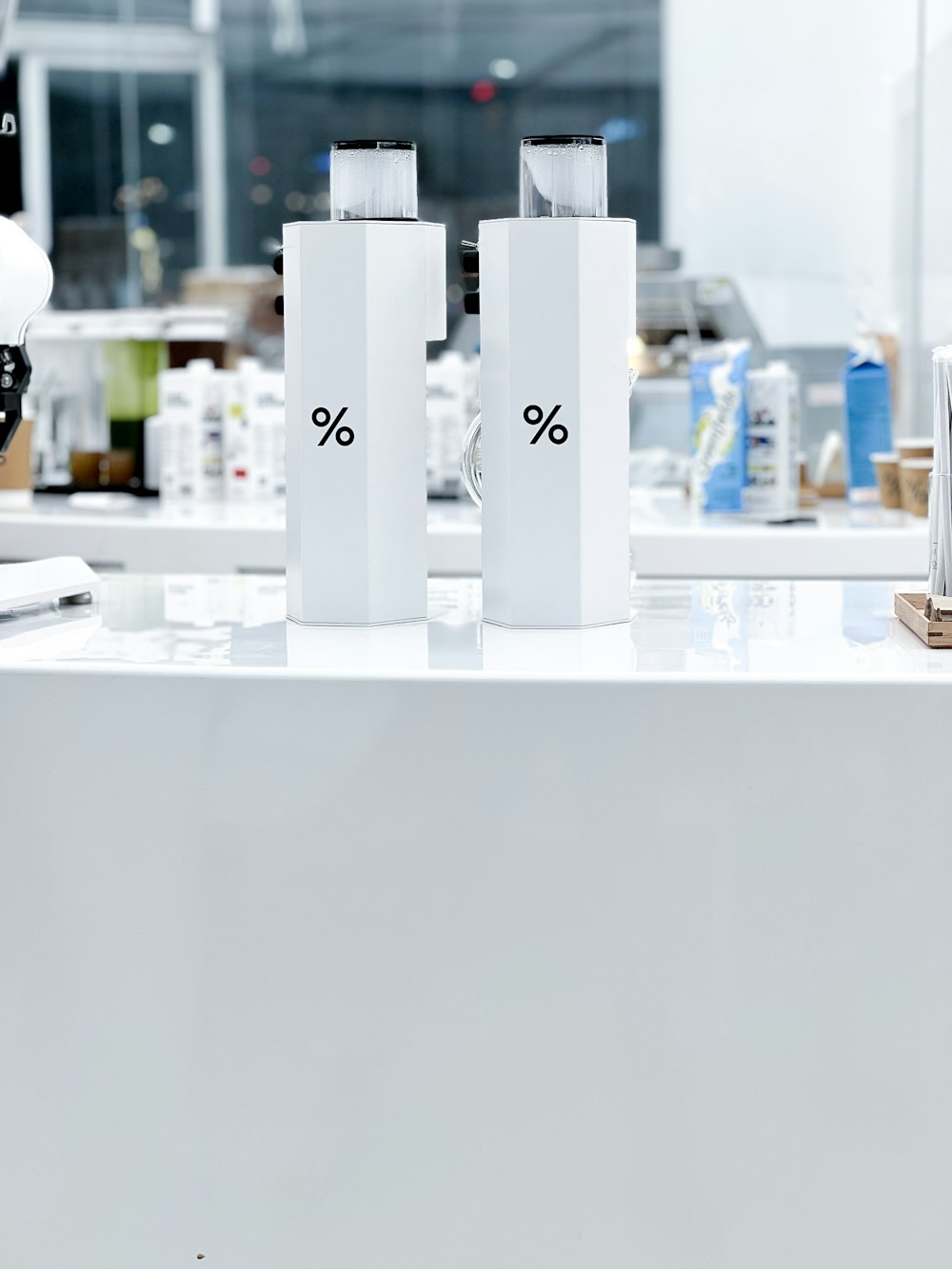 a white counter with three white boxes on top of it