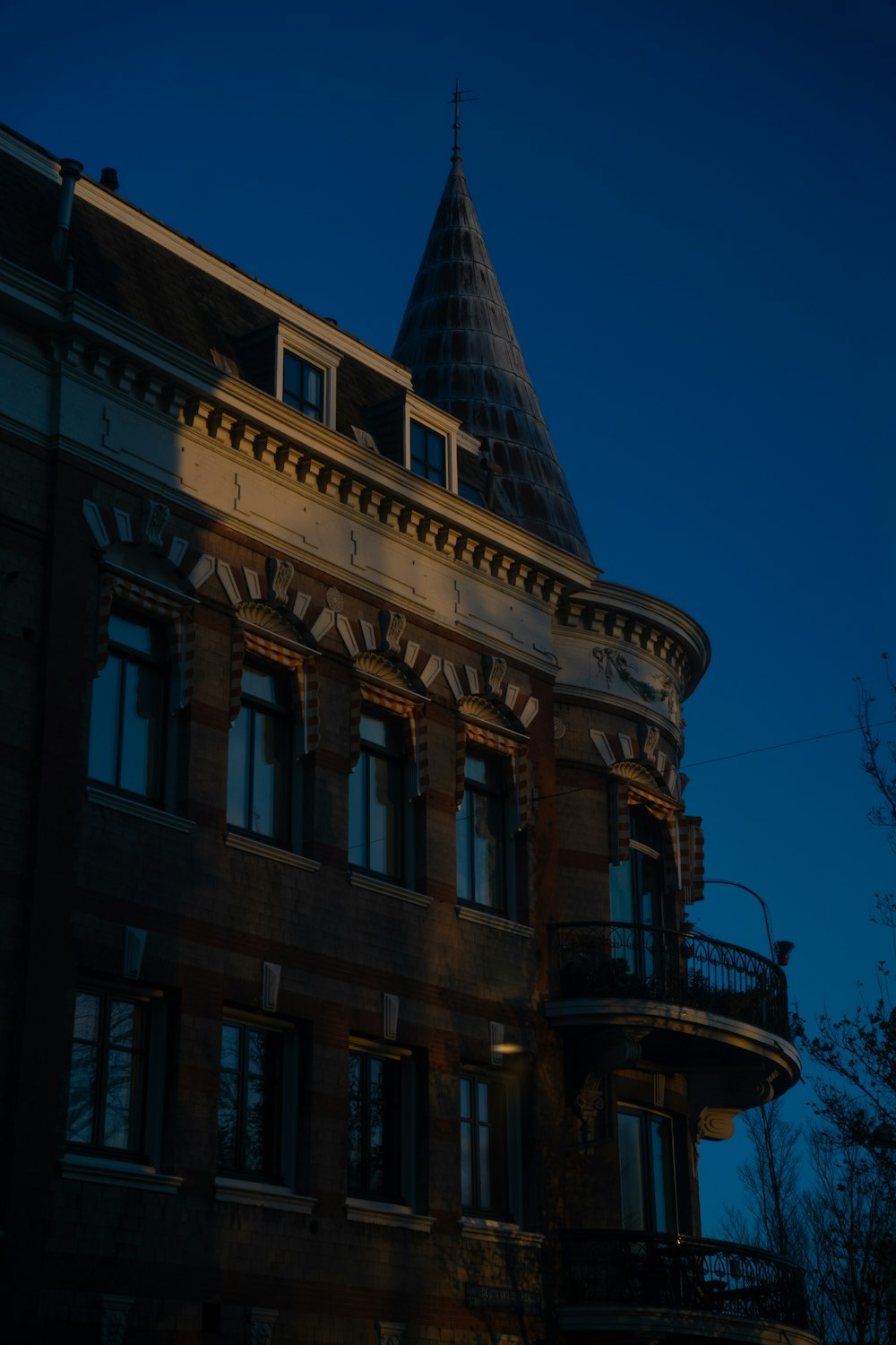 a tall building with a clock on the top of it