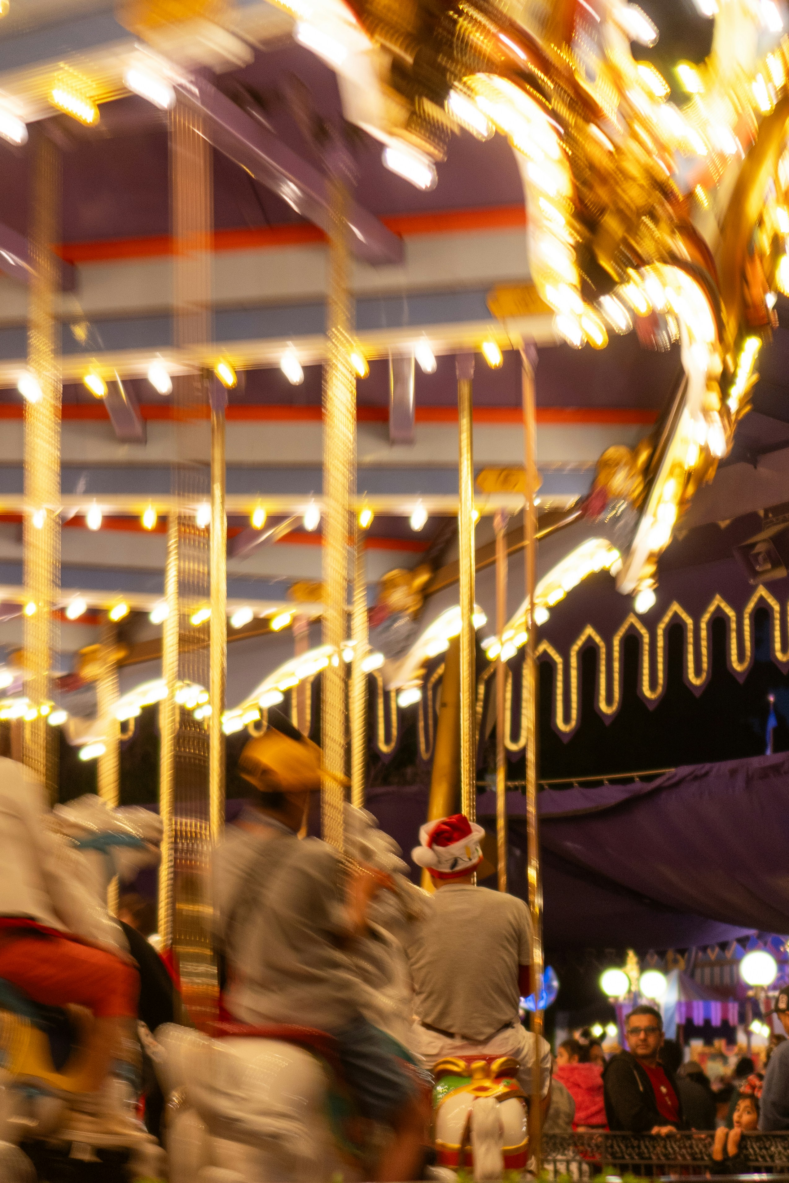 a blurry photo of a carousel at a carnival
