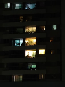 Night view of a high-rise apartment building lit up