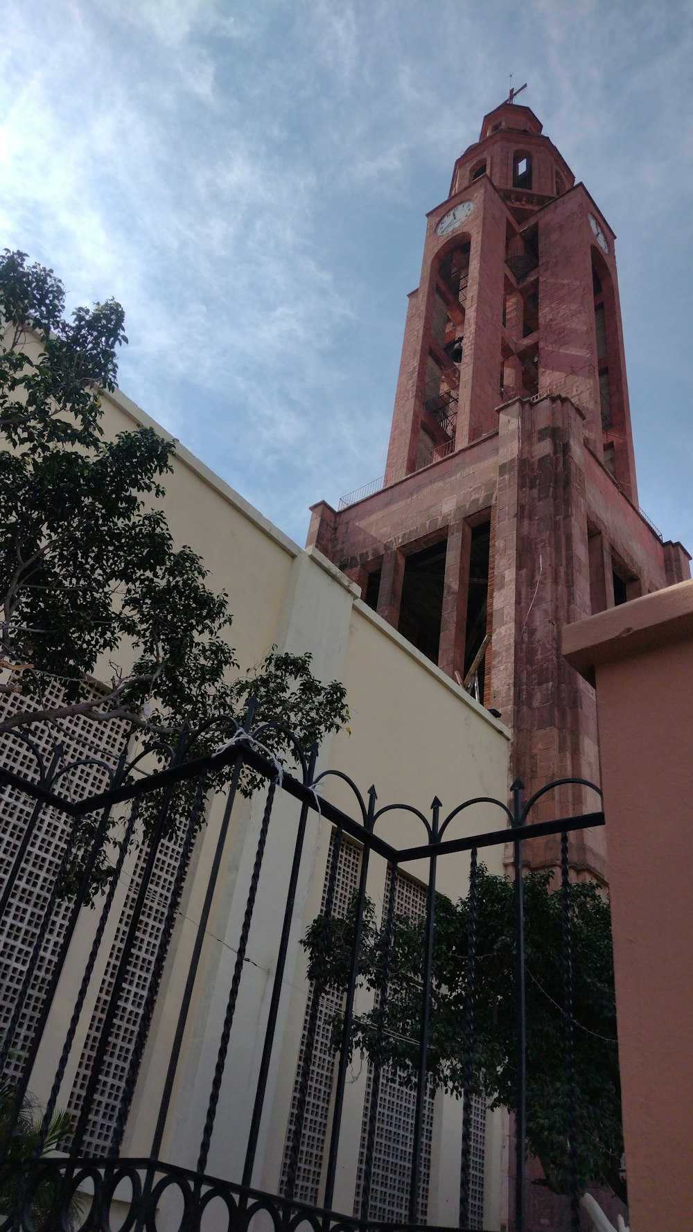 a tall clock tower towering over a city