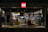 Close-up of a clear acrylic display case showcasing colorful Lego sets with soft lighting.