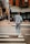 A person jogging in a vibrant tracksuit on a city street.