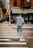 A person jogging in a vibrant tracksuit on a city street.
