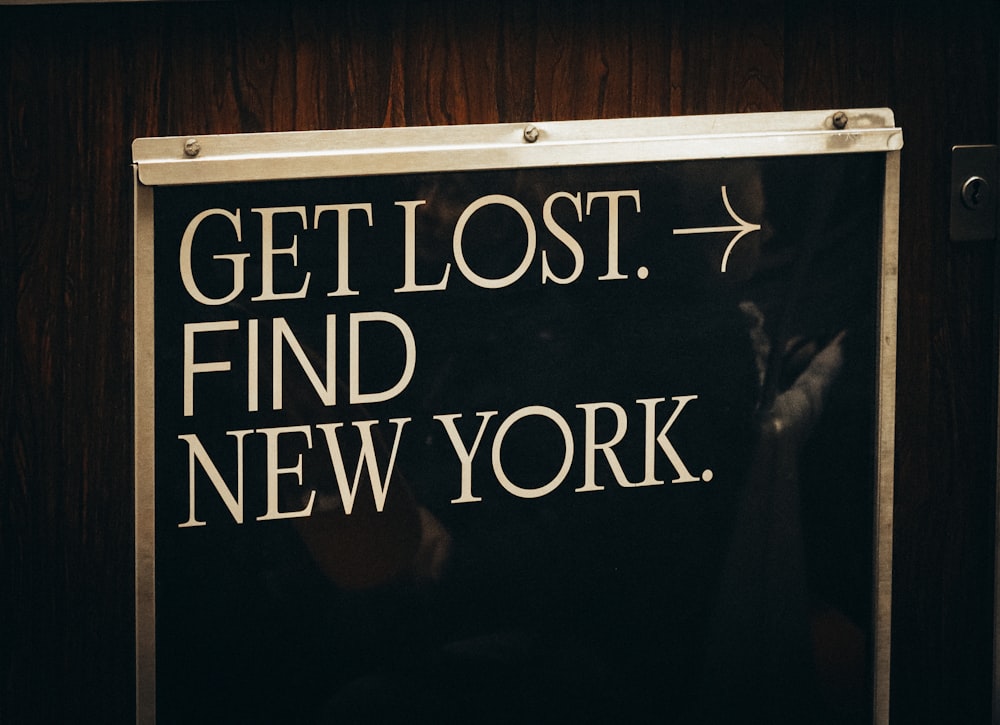 a sign that says get lost find new york