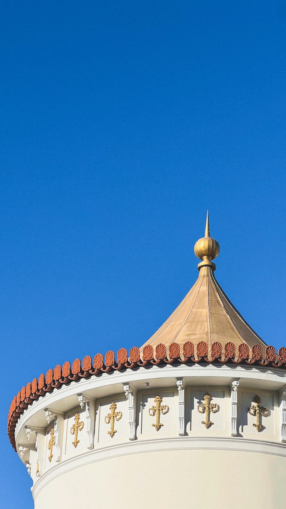 a large white building with a clock on it's side