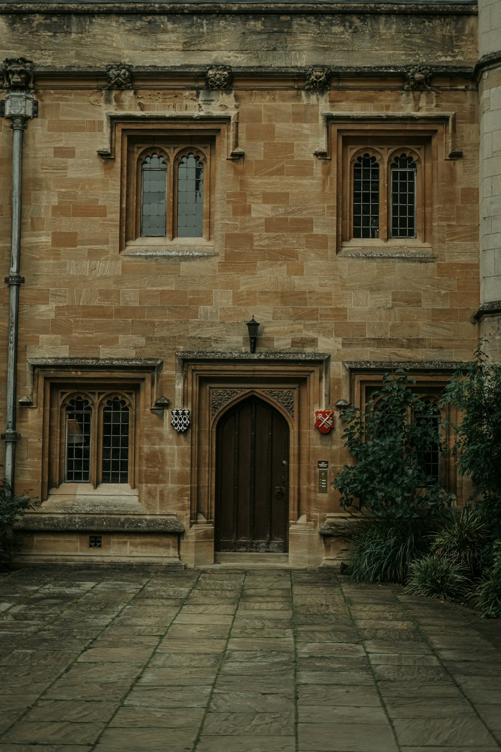 a stone building with a clock on the front of it